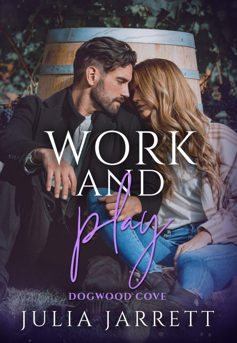 Couple sitting next to each other in front of a wine barrel. Work and Play by Julia Jarrett.