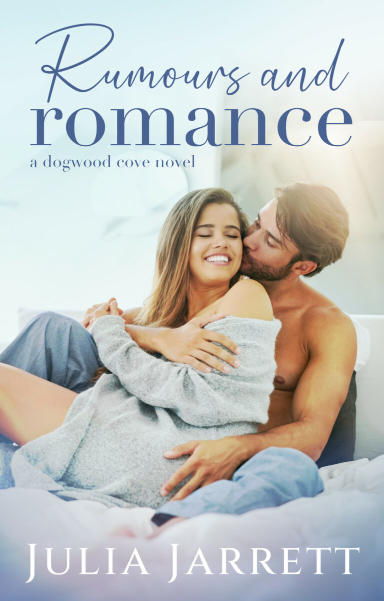 Couple snuggling in bed. Man is kissing women's cheek. Book title, Rumours and Romance by Julia Jarrett.